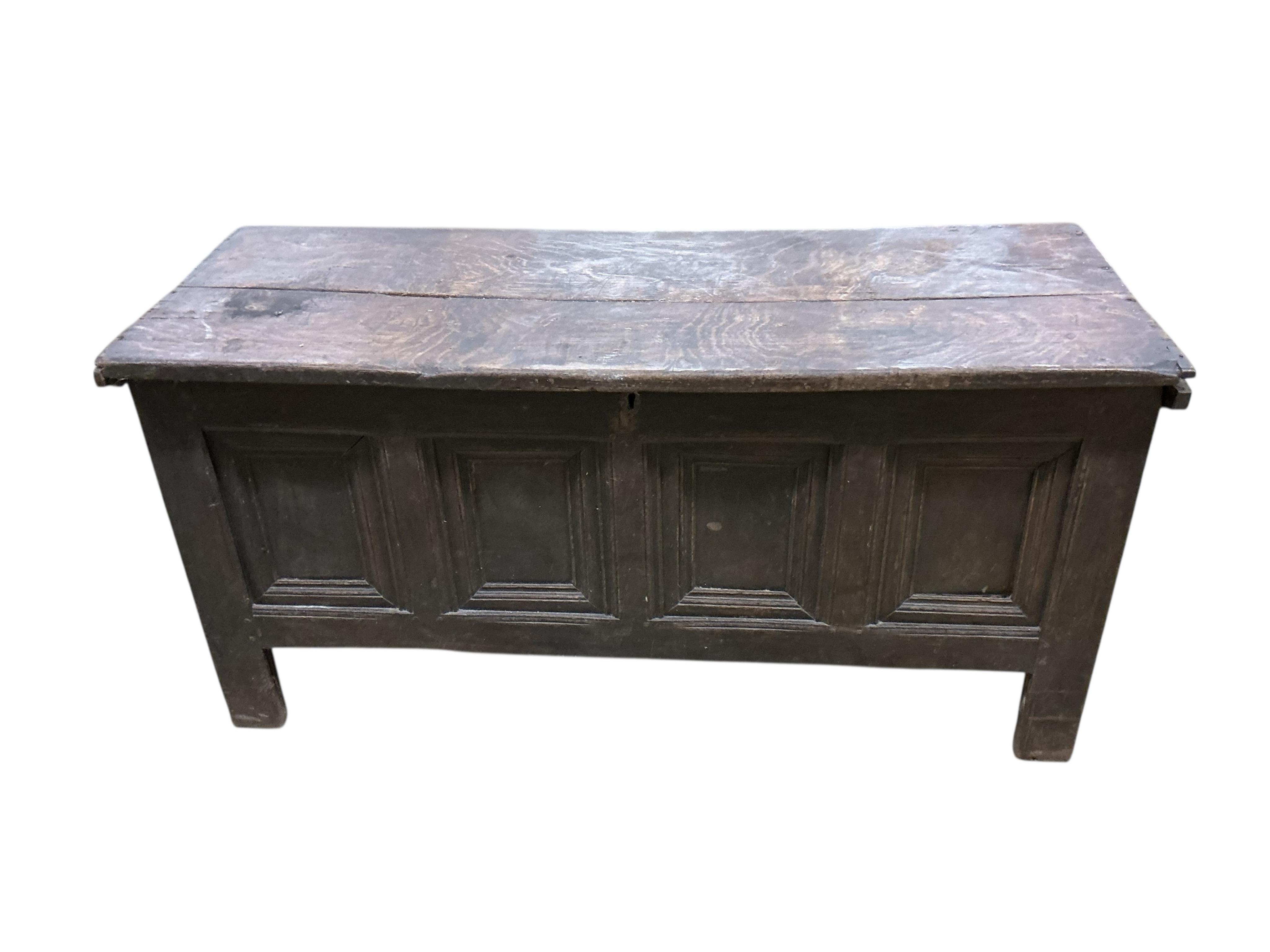 An 18th century panelled oak coffer, width 144cm, depth 54cm, height 72cm